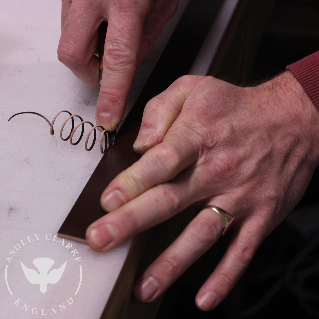 a person cutting bridle leather used for Ashley Clarke England products