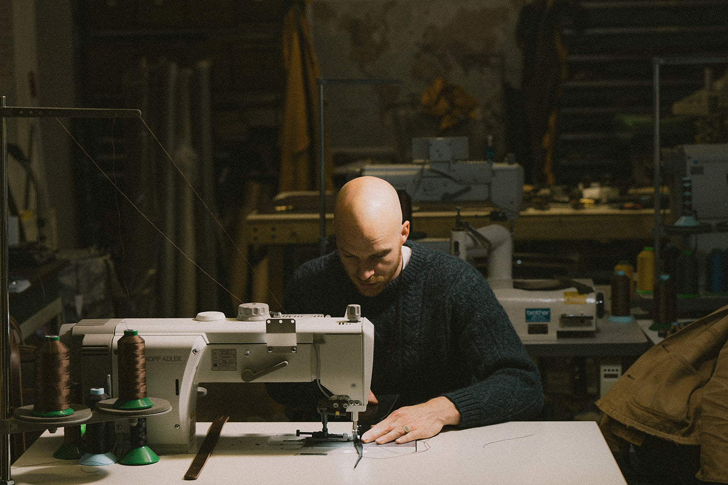 Ashley Clarke sewing on a sewing machine