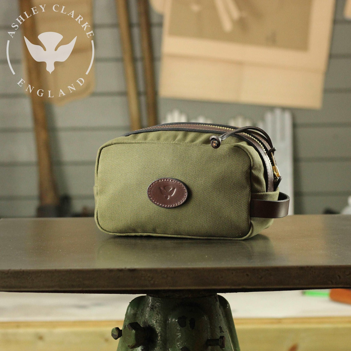a waxed canvas wash bag by ashley clarke england on top of a table workshop 1 
