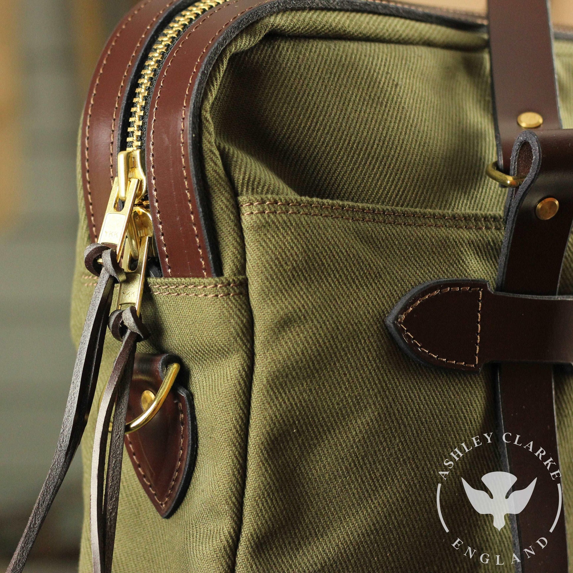 close up of the green waxed canvas briefcase laptop bag by ashley clarke angle 2 