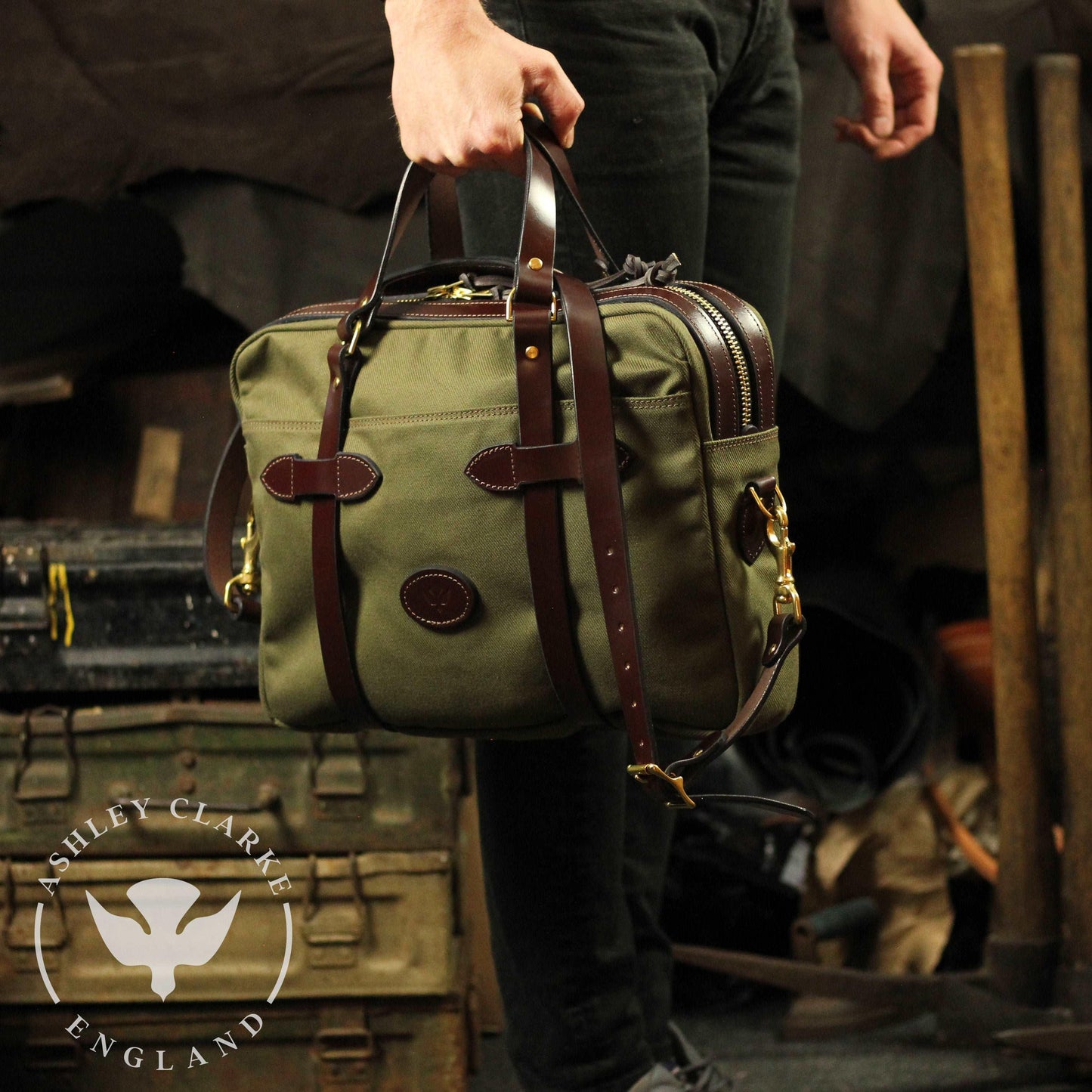 green waxed canvas briefcase by ashley clarke england being carried by a person